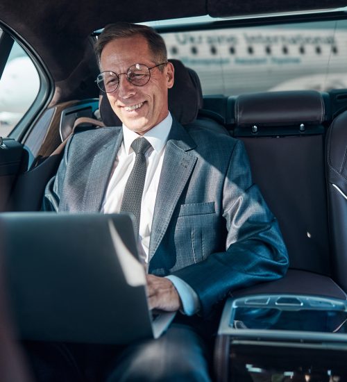 Cheerful,Elegant,Man,In,Glasses,Is,Sitting,In,Car,With